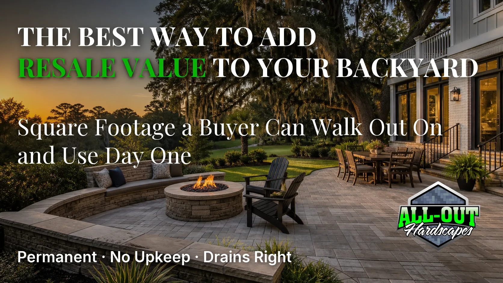A paver patio with a seat wall and fire pit behind a Savannah, Georgia home at golden hour