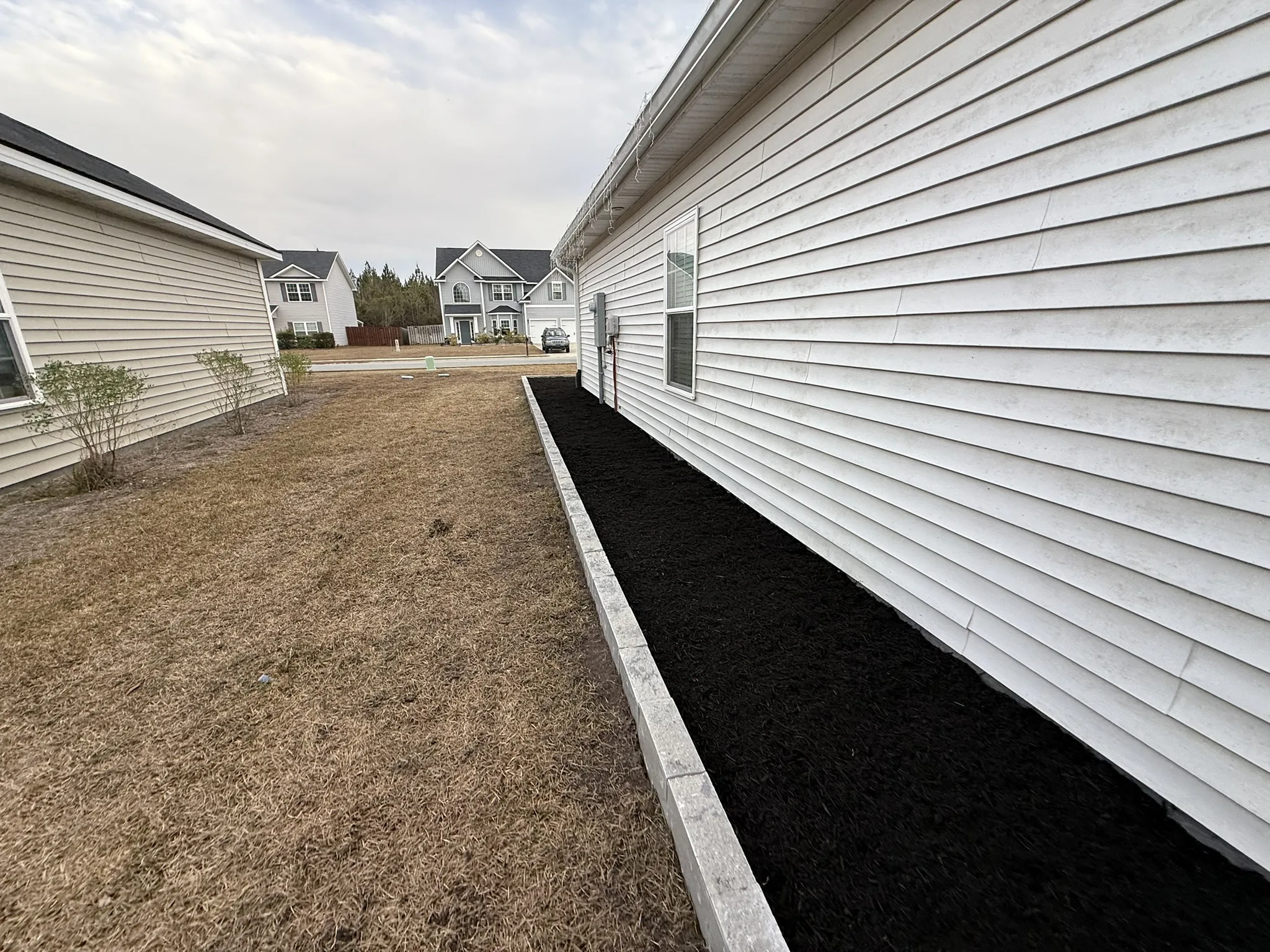 CarMicheals Residence -- Block-Bordered Landscape Beds with Paver Fire Pit photo