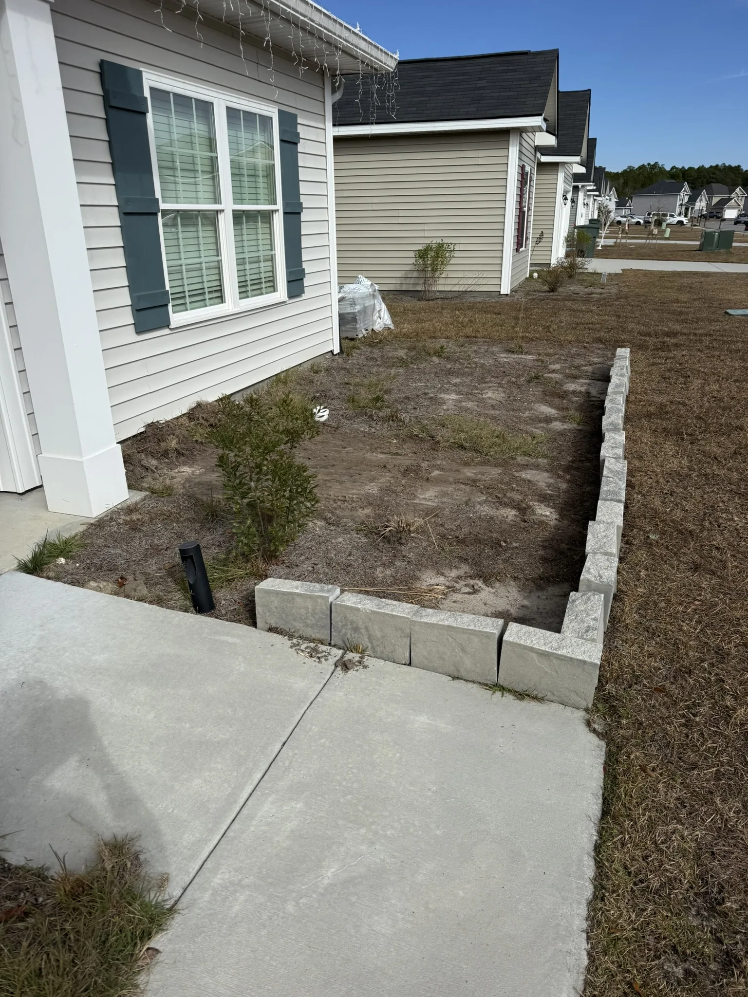 CarMicheals Residence -- Block-Bordered Landscape Beds with Paver Fire Pit photo