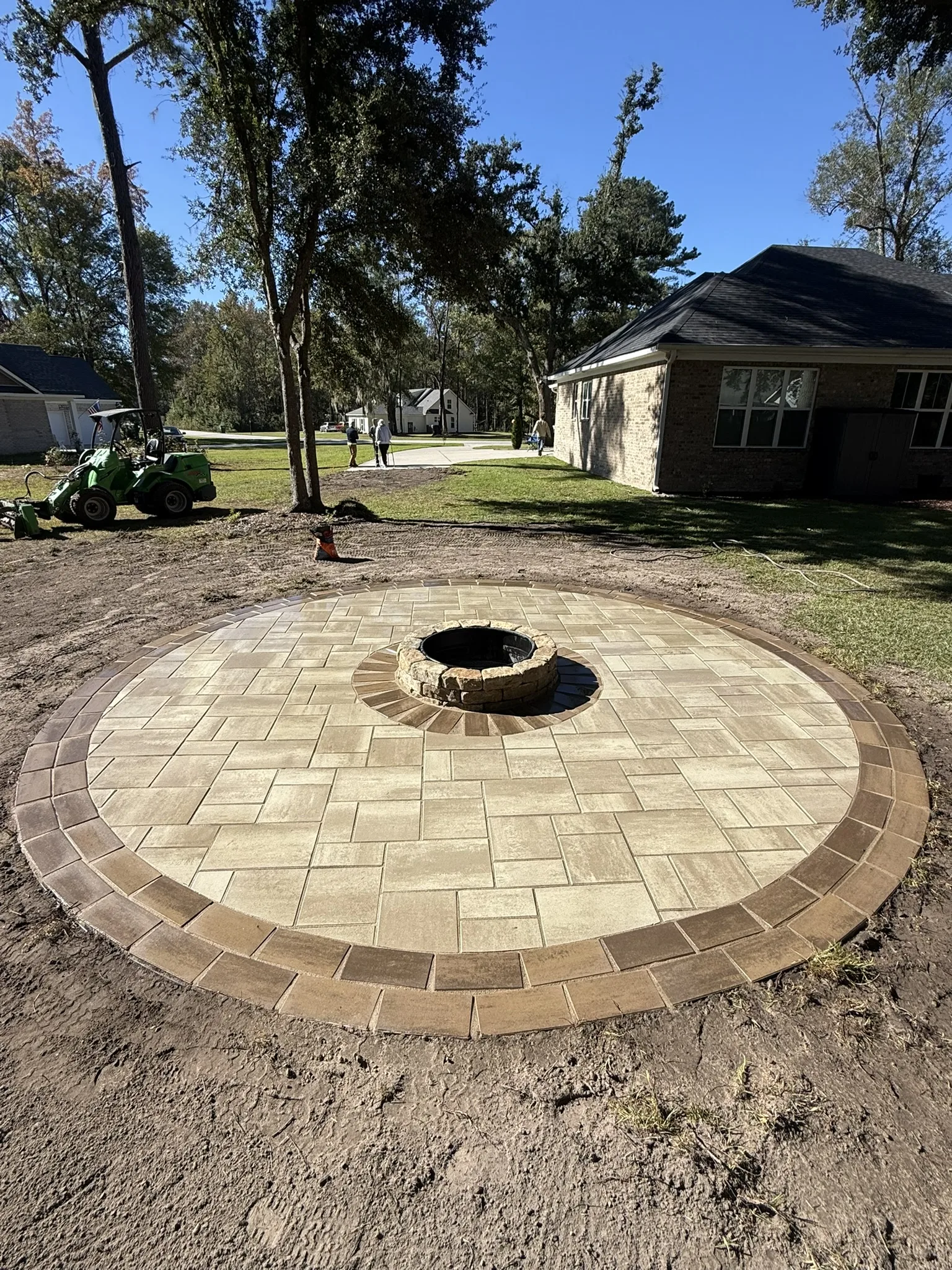 LeBlanc Residence -- Round Paver Patio with Built-In Fire Pit photo