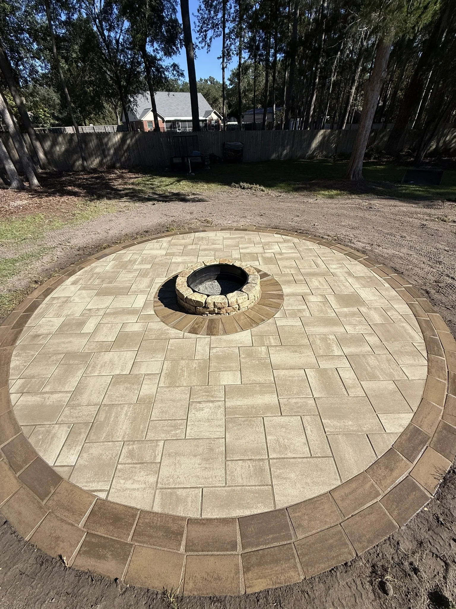 LeBlanc Residence -- Round Paver Patio with Built-In Fire Pit photo