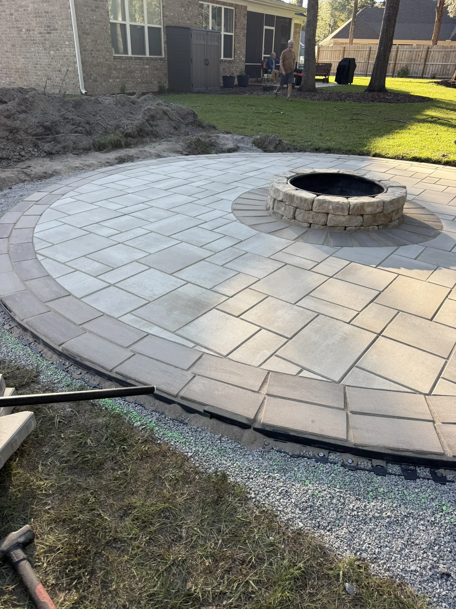 LeBlanc Residence -- Round Paver Patio with Built-In Fire Pit photo