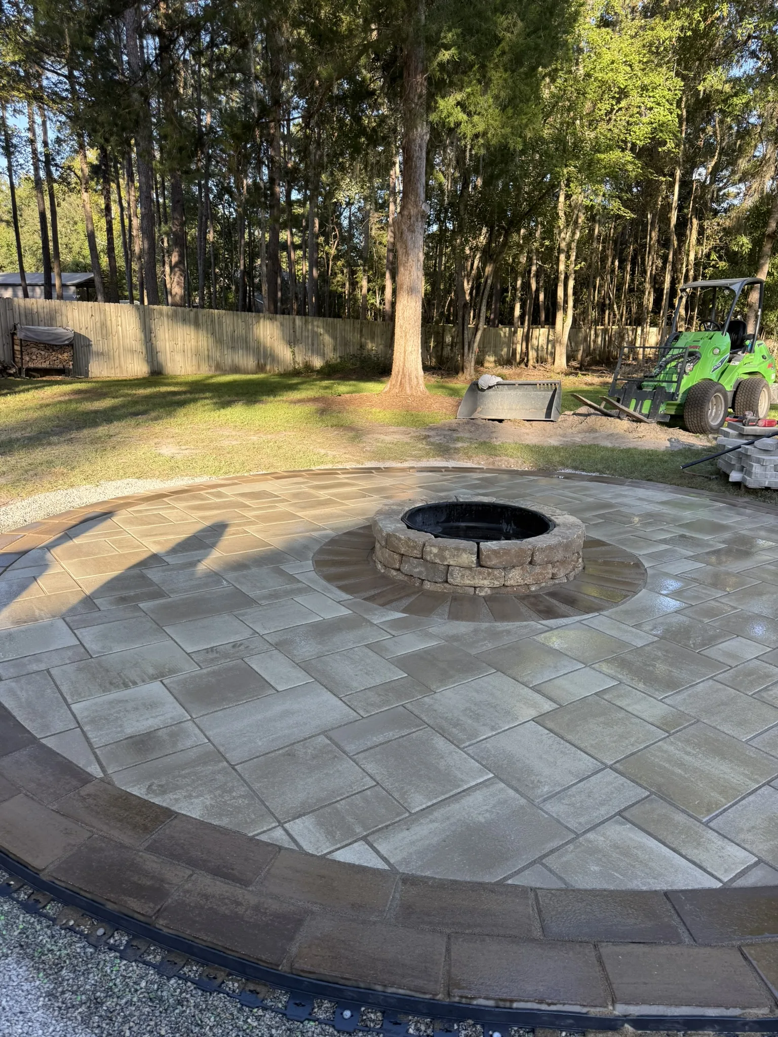LeBlanc Residence -- Round Paver Patio with Built-In Fire Pit photo