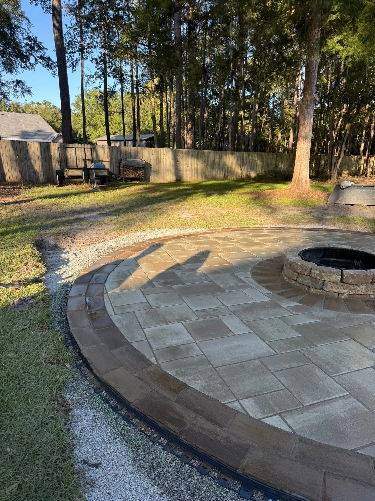 LeBlanc Residence -- Round Paver Patio with Built-In Fire Pit photo