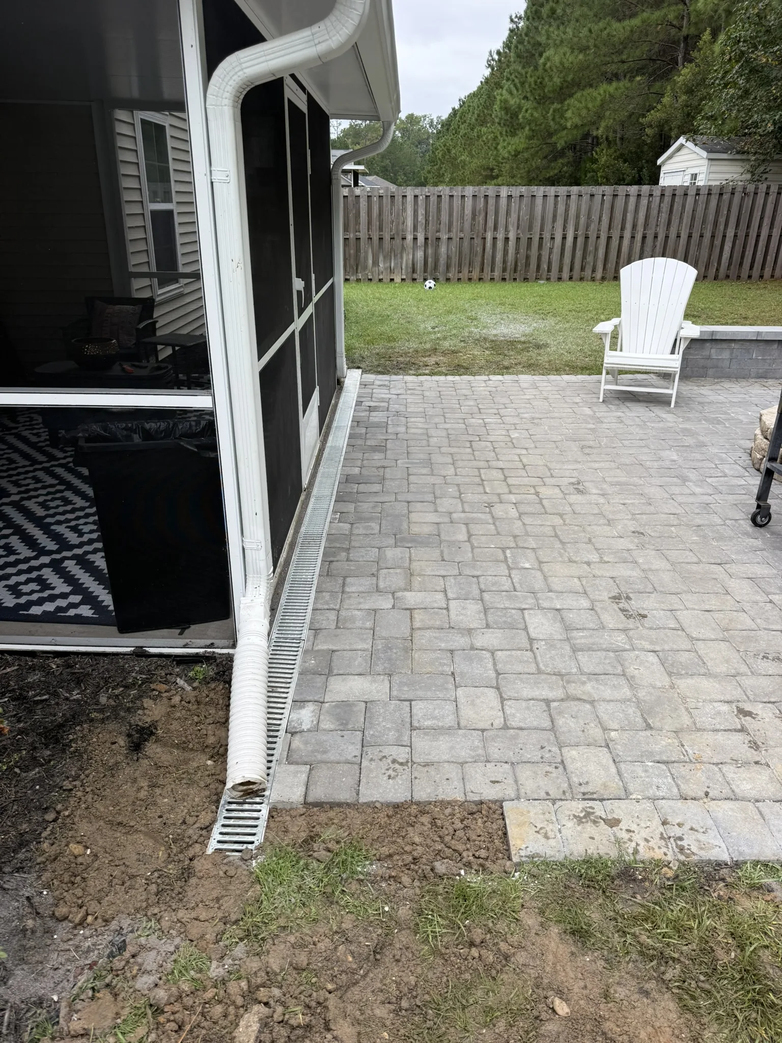 Gigi and Chris -- Paver Patio with Seat Wall and Channel Drain photo