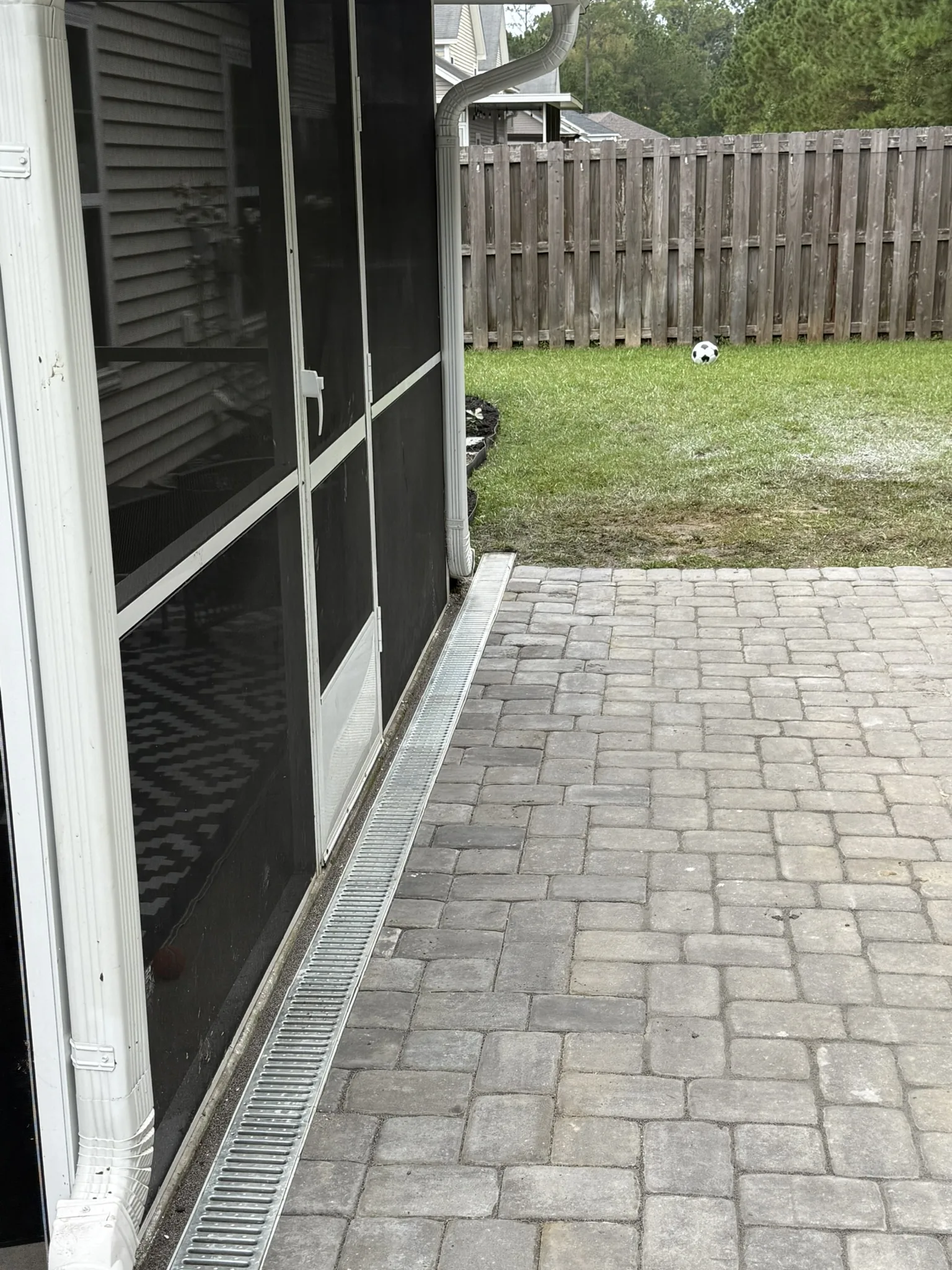 Gigi and Chris -- Paver Patio with Seat Wall and Channel Drain photo
