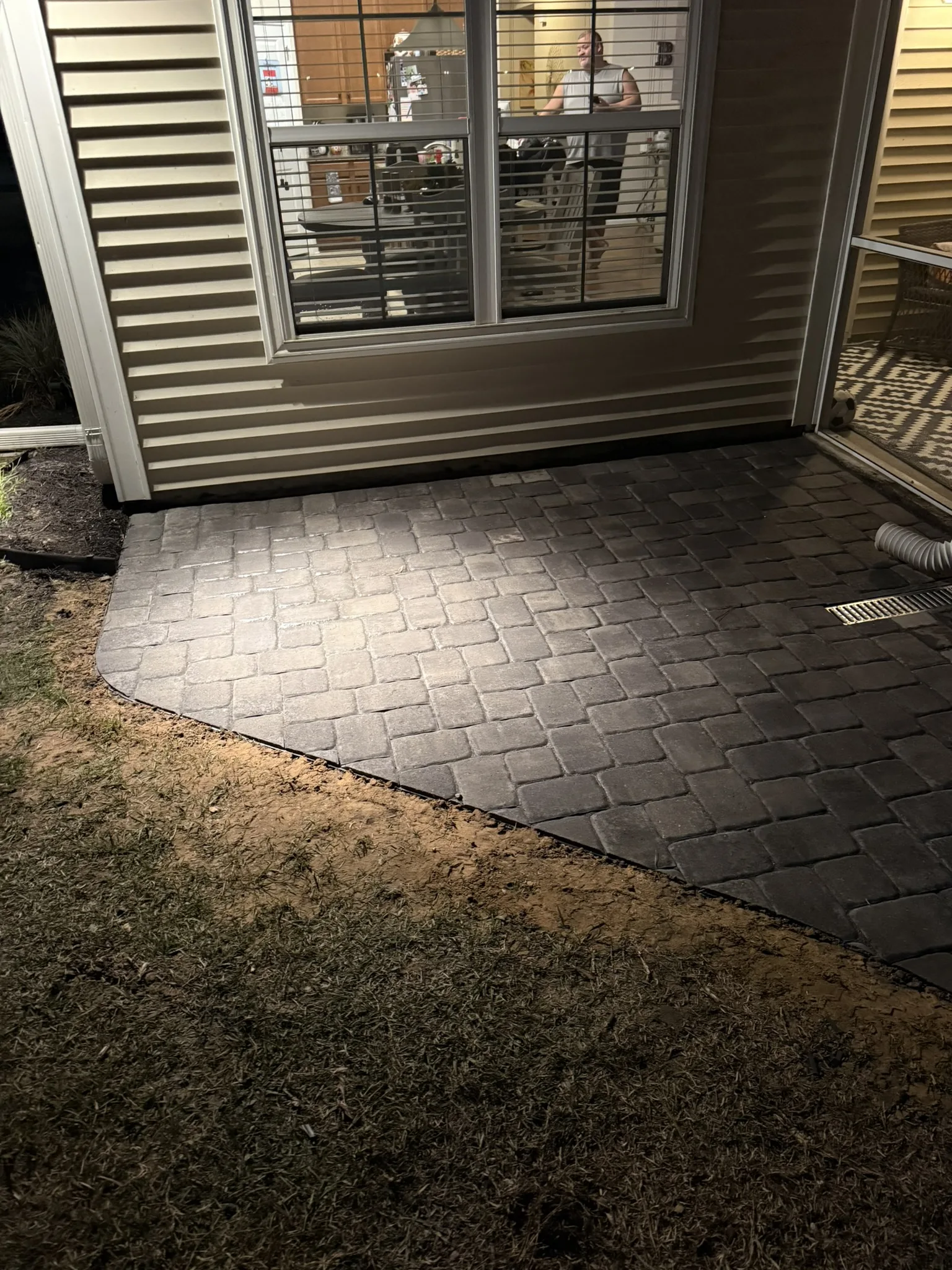 Gigi and Chris -- Paver Patio with Seat Wall and Channel Drain photo