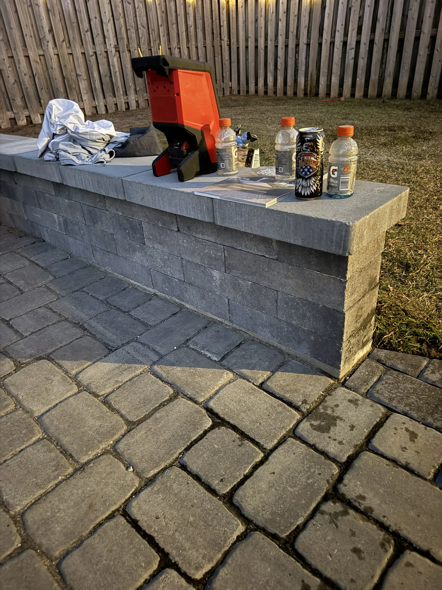 Gigi and Chris -- Paver Patio with Seat Wall and Channel Drain photo