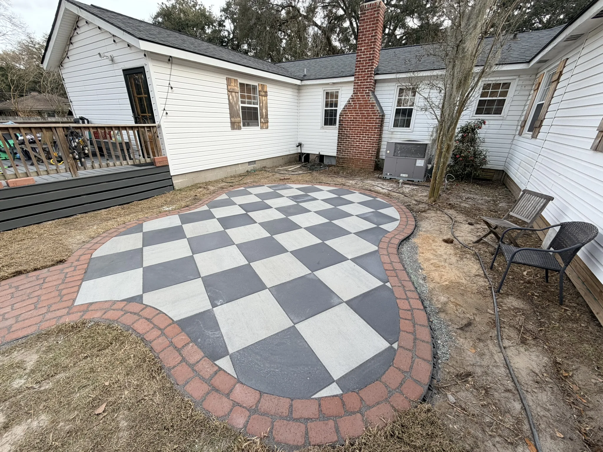 Pope Residence -- Checkerboard Patio with Brick Paver Walkway photo