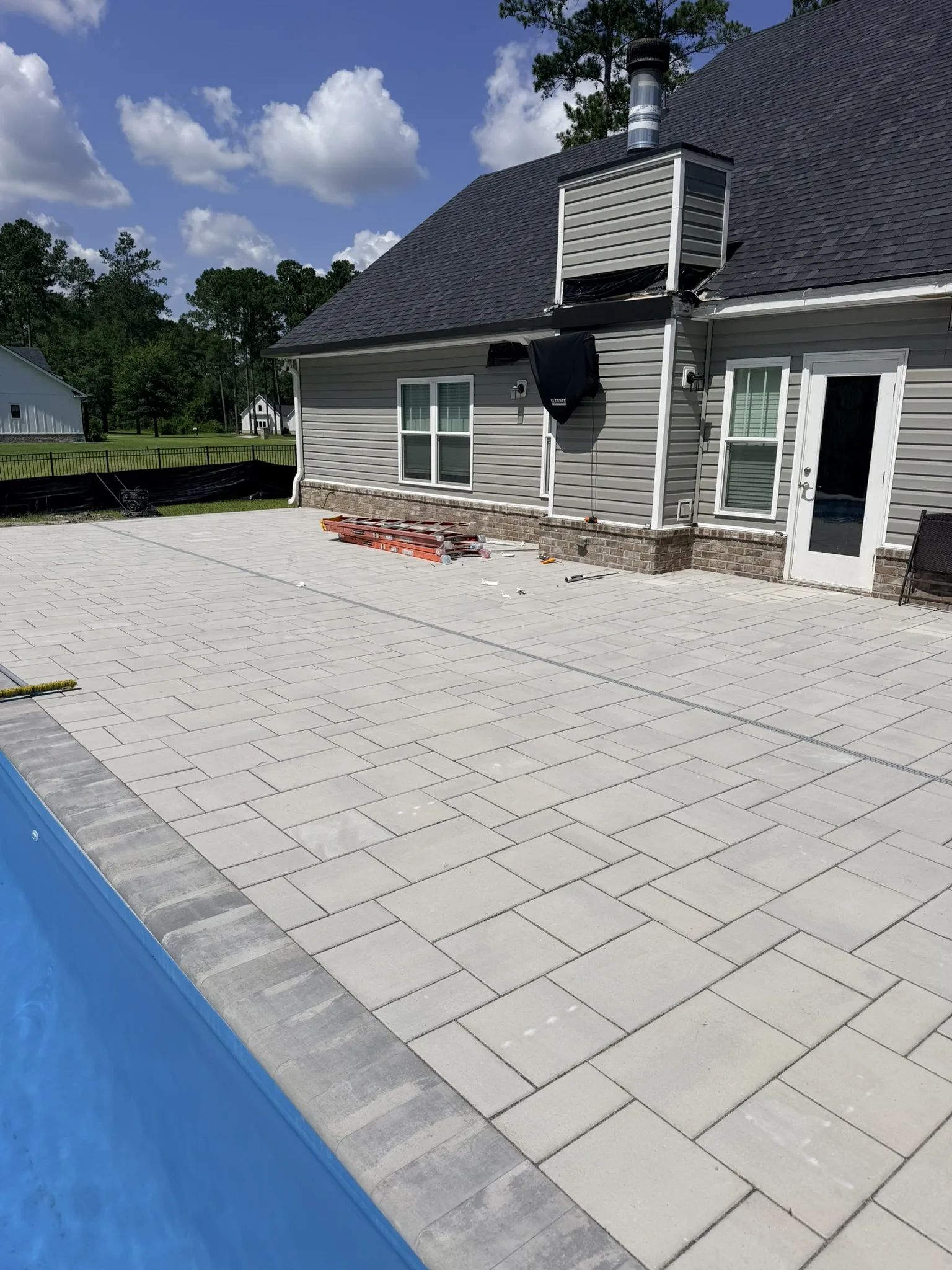 Hammer Residence -- Pool Deck Paver Replacement with Trench Drain