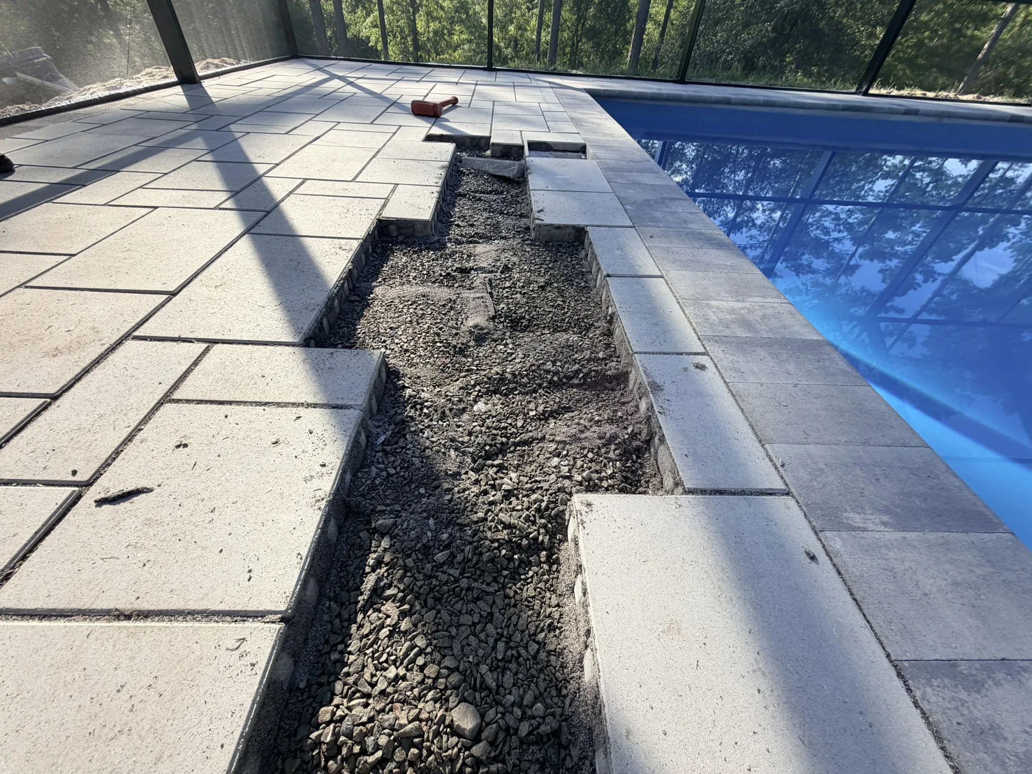 Hammer Residence -- Pool Deck Paver Replacement with Trench Drain photo