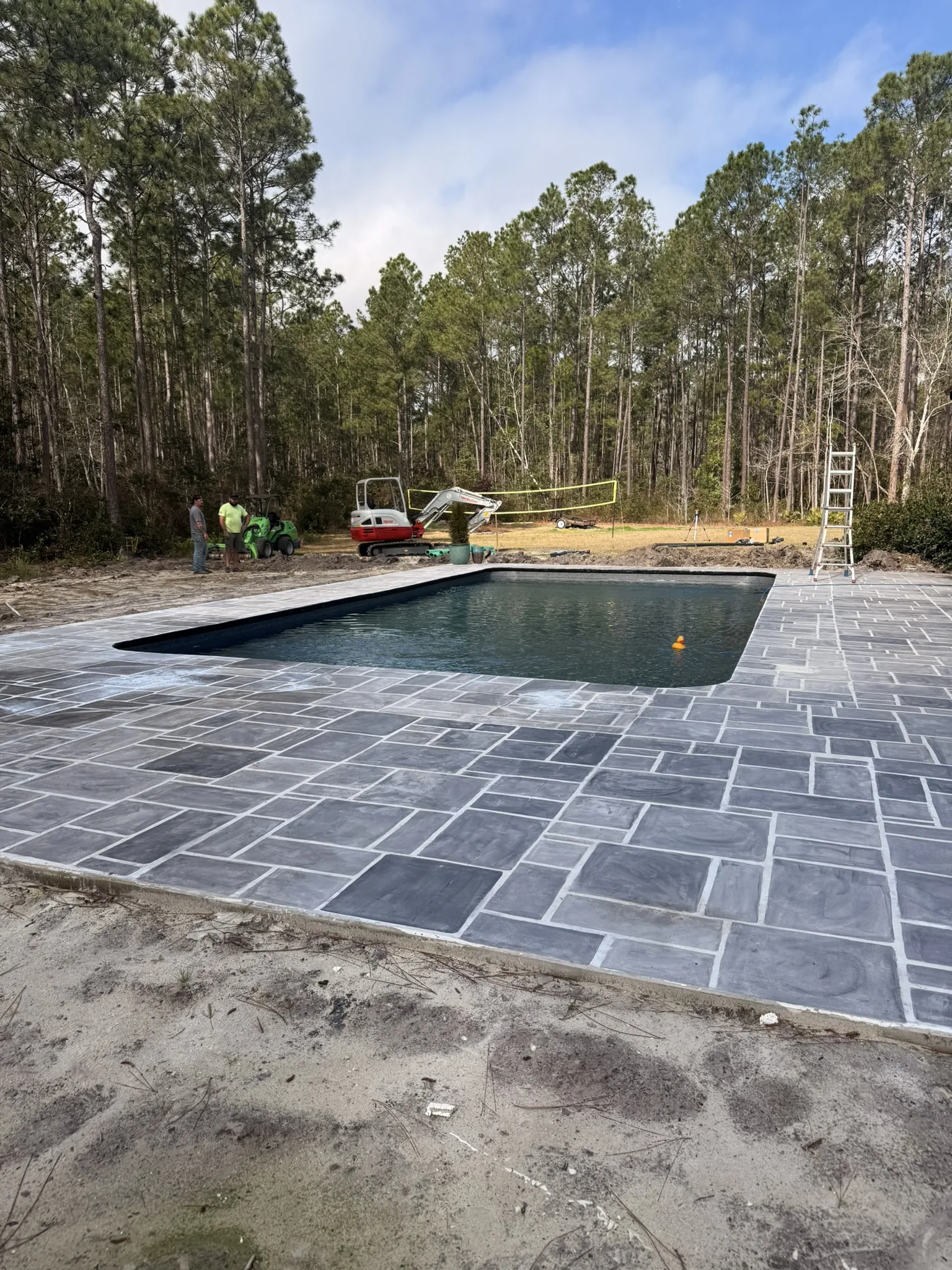 Kay Residence -- Paver Pool Deck with Downspout Drainage photo