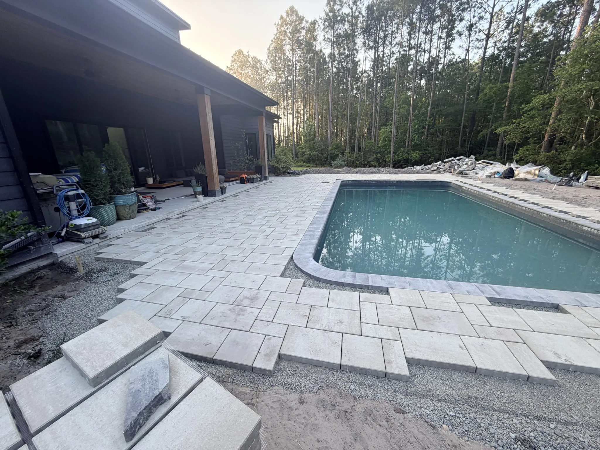 Kay Residence -- Paver Pool Deck with Downspout Drainage photo